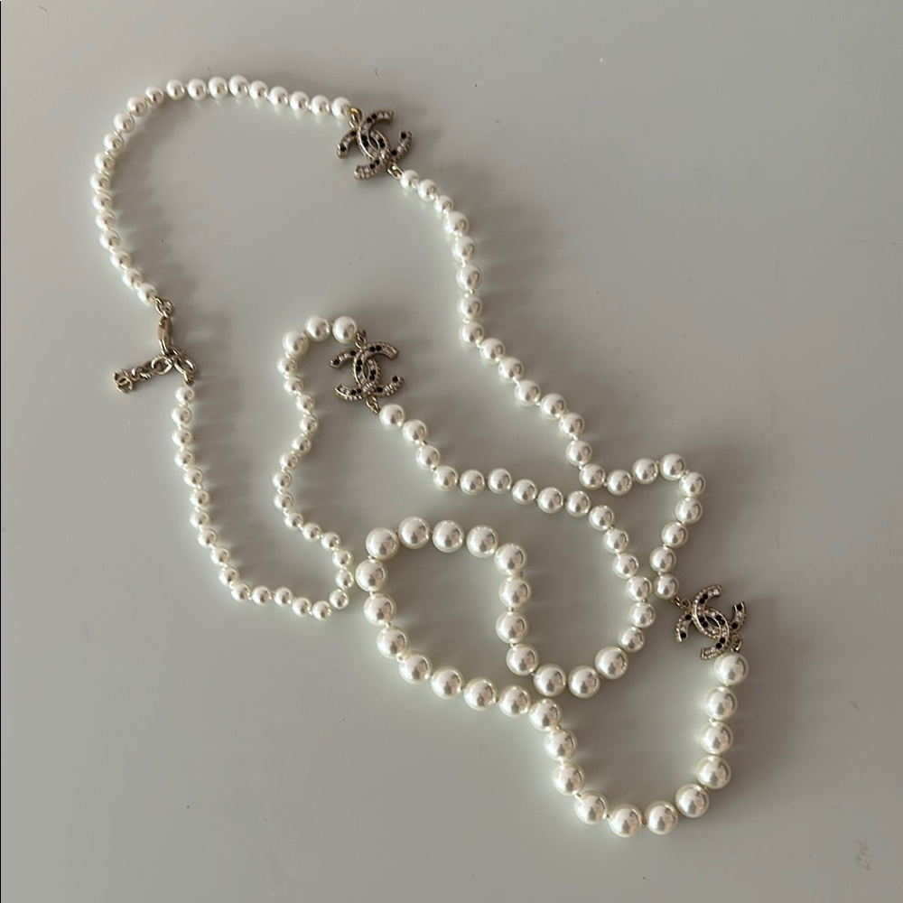 Chanel long costume pearl necklace with CC logo charms